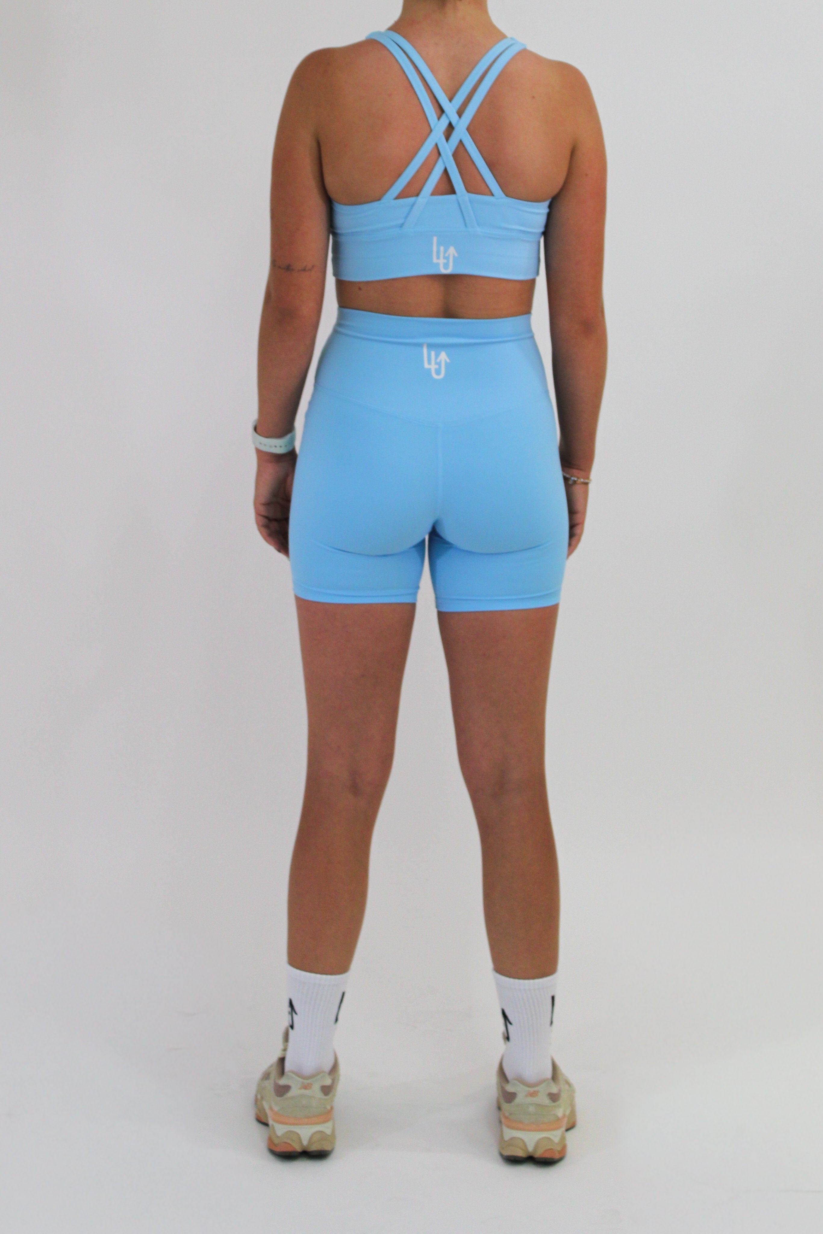 PERFORMANCE CRISSCROSS BRA WOMAN - LIGHT BLUE